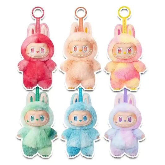 Set of six colorful plush labubu toys  on a white background